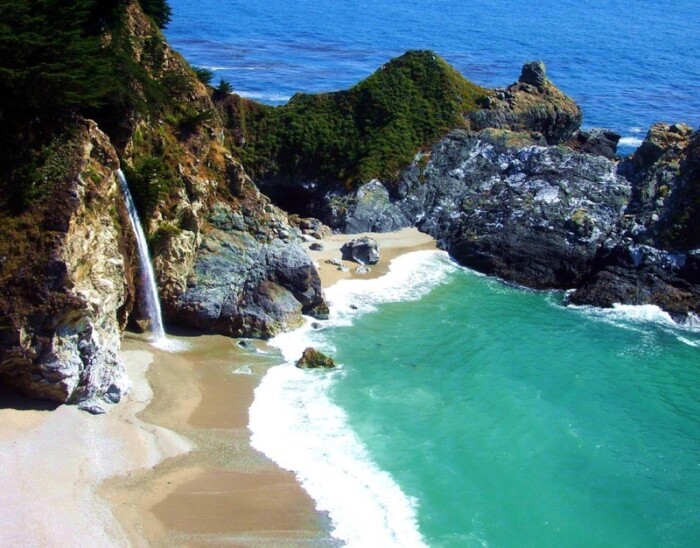 McWay Falls plunges off a cliff and into a turquoise cove.