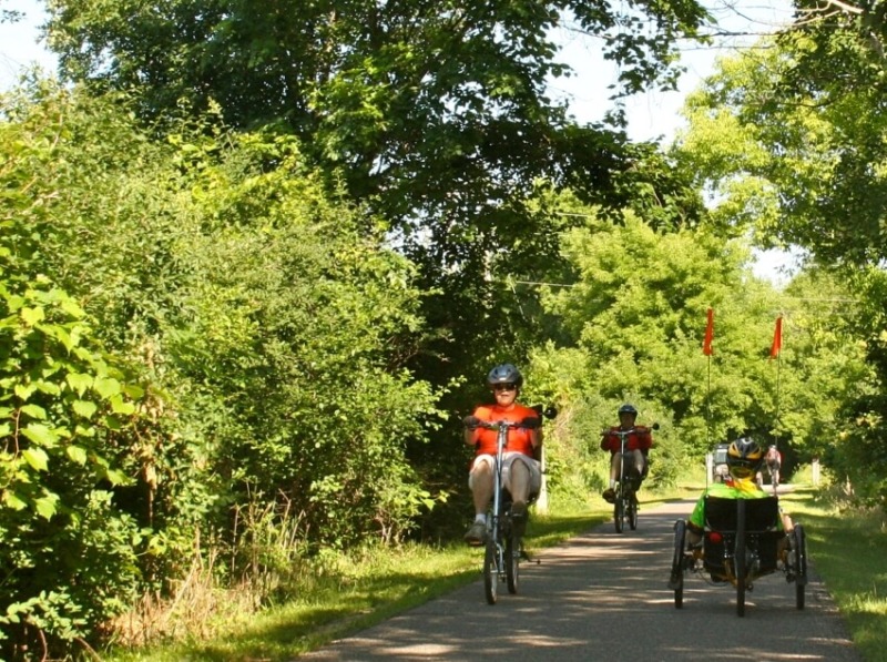 Group of People Biking on a Trail