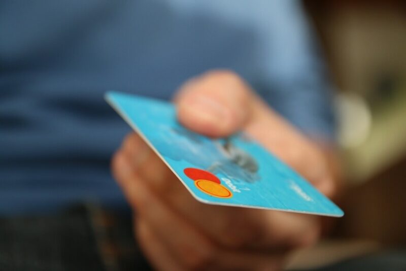 Man Handing Over a Credit Card