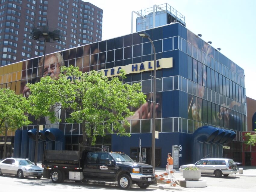 Tree and Parked Cars In front of the Orchestra Hall Building