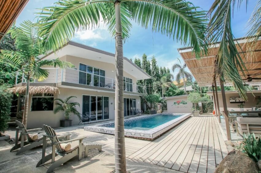 Building and Palm Trees by the Pool