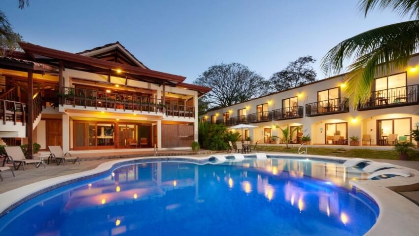 Building Front and Pool of  Coast Beachfront Hotel