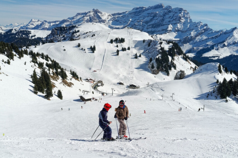 Tow People on a Mountain Covered in Snow