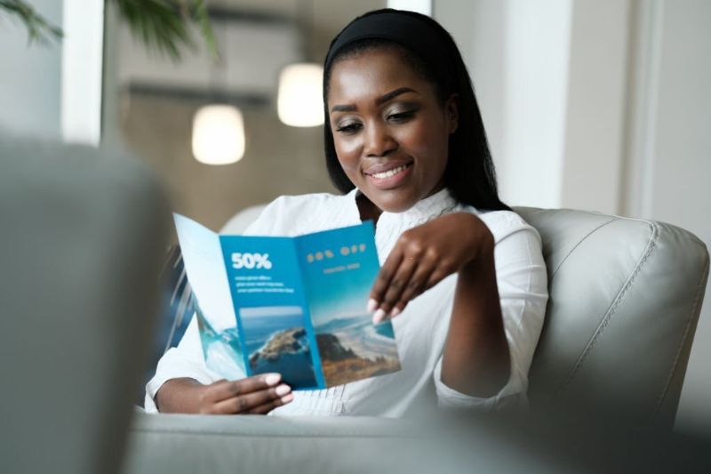 Woman looking on a travel brochure