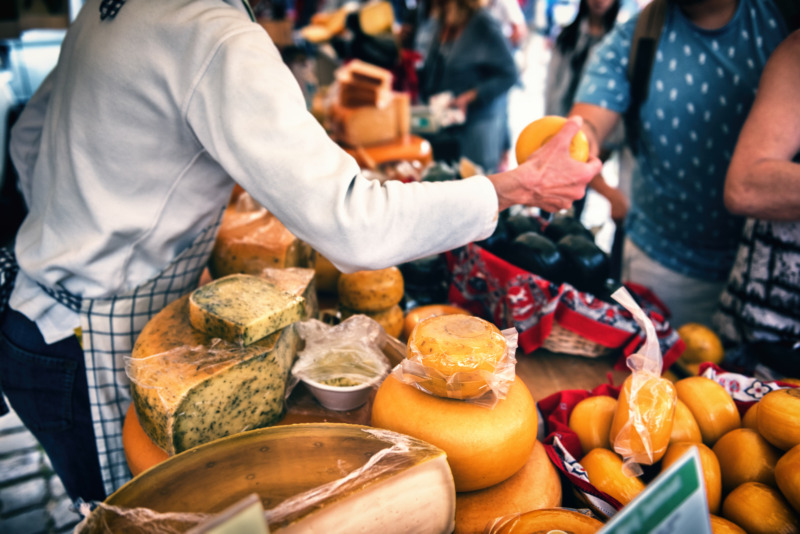 Selection of Dutch cheese at farmers traditional market. Food background