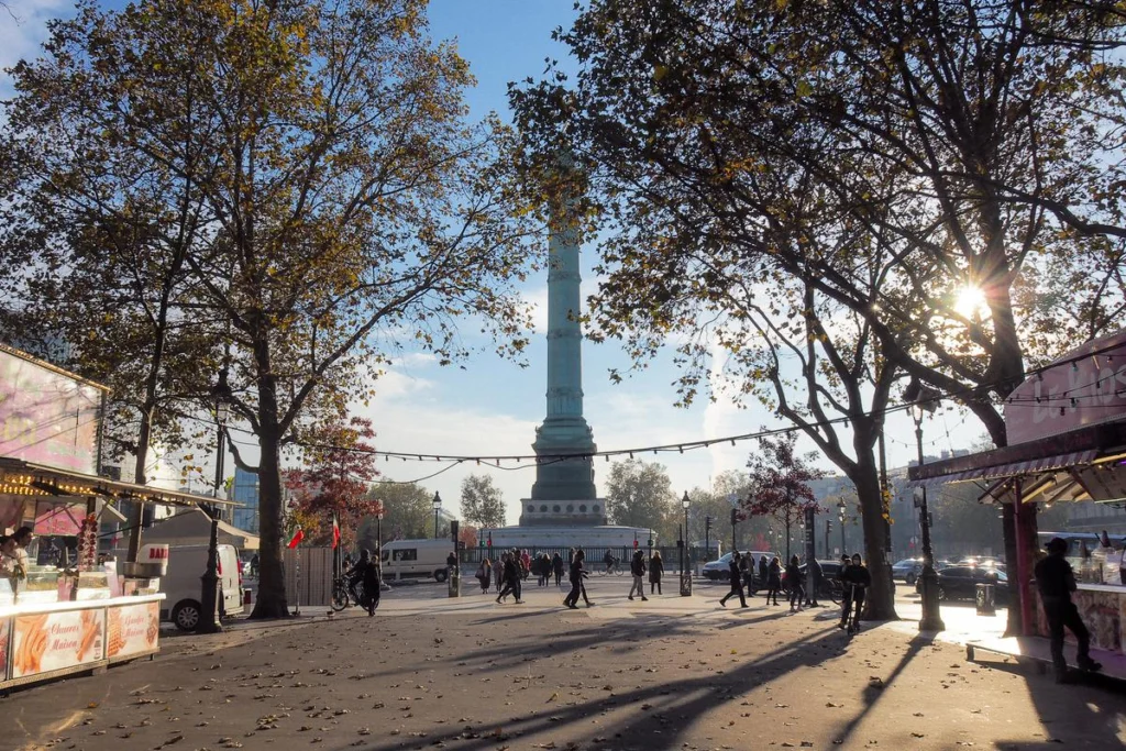 Autumn morning at Place de la Bastille in Paris, featuring the July Column and Parisian street life