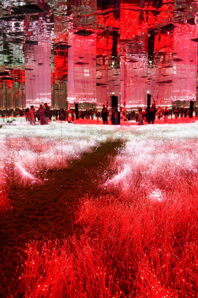 Mirrored columns and red fiber-optic lights inside AYA Universe