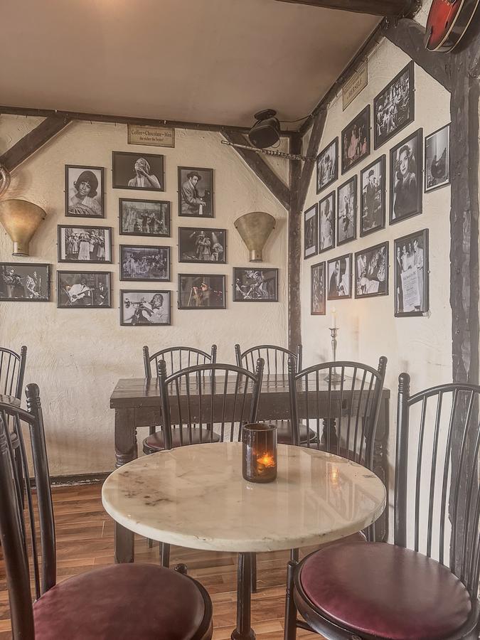 Cozy interior of Café Bacchus in Stavanger with jazz-themed decor and candlelit tables