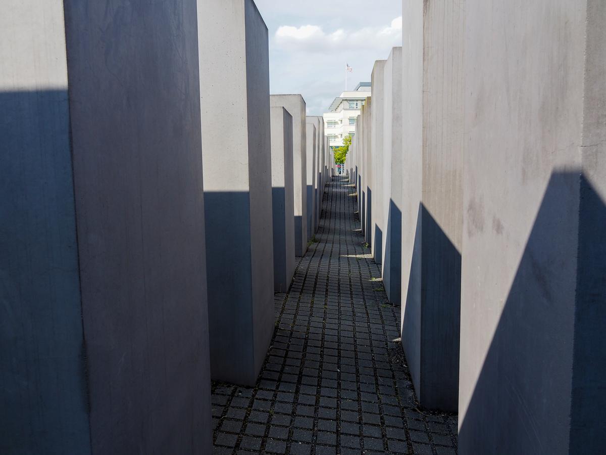 Berlin Holocaust Memorial stelae under cloudy sky