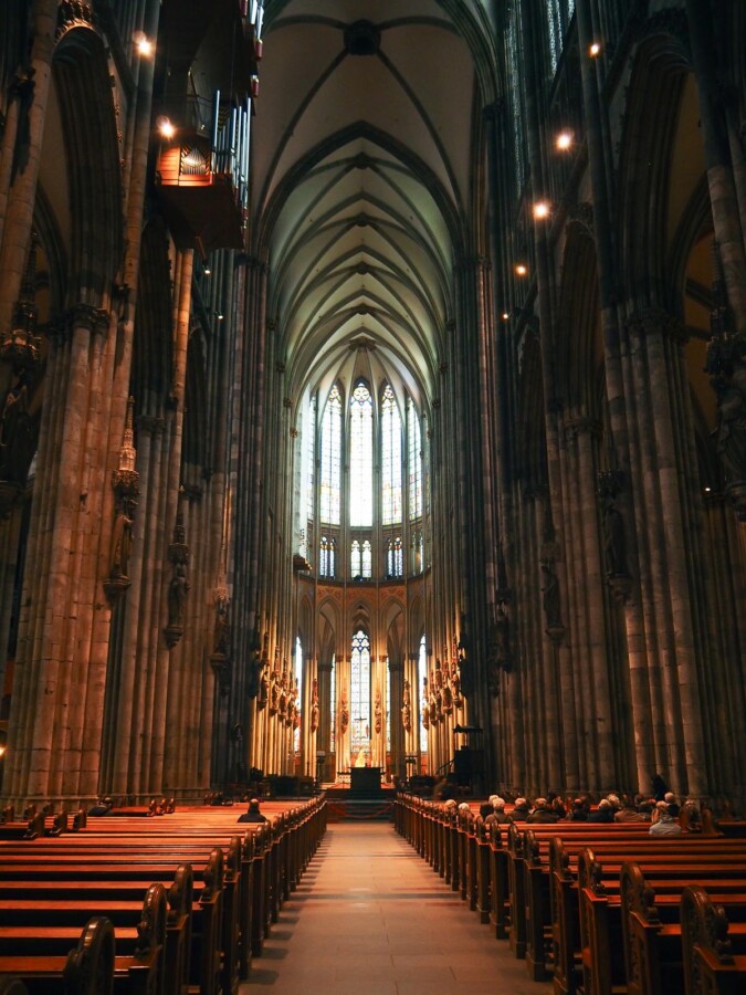 Cologne Cathedral’s Gothic interior with stained glass and ribbed vaults