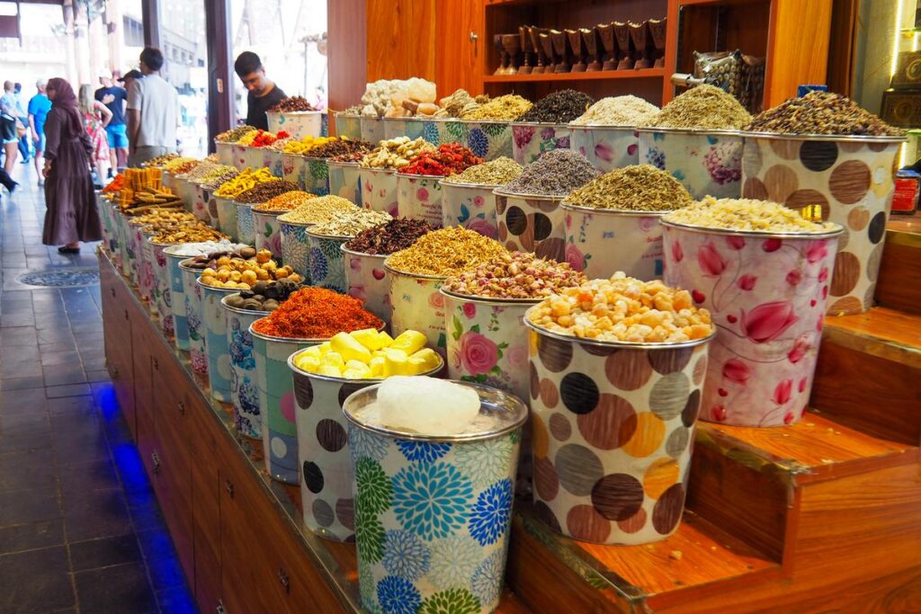 Colorful spices displayed at a market stall near Dubai Gold Souk
