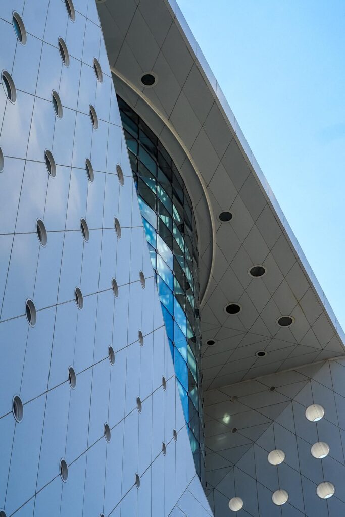 Curved glass exterior of The Green Planet biodome at City Walk Dubai
