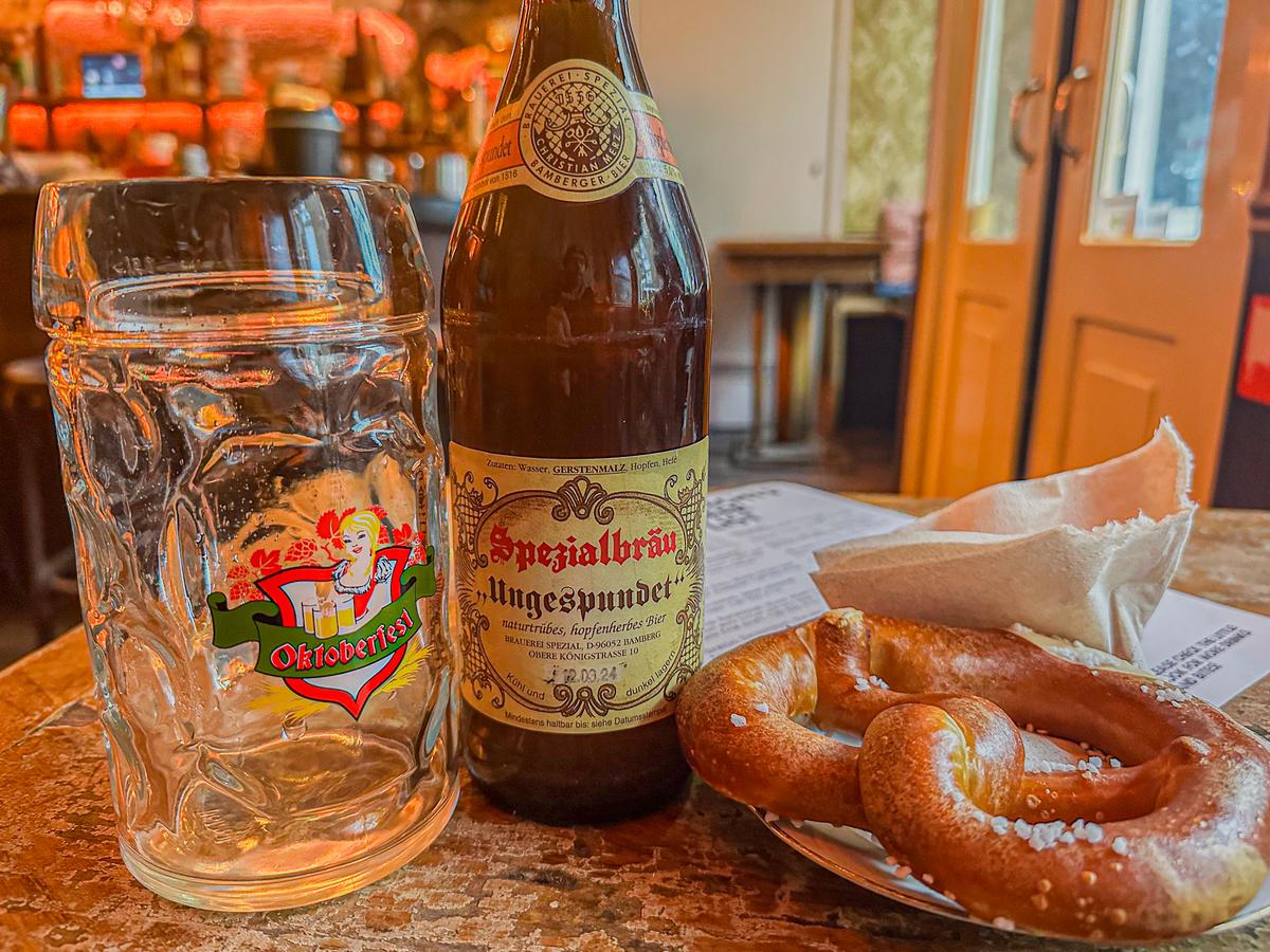 Authentic German Rauchbier and pretzel in a tavern