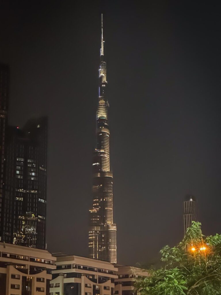 Burj Khalifa illuminated at night above Downtown Dubai
