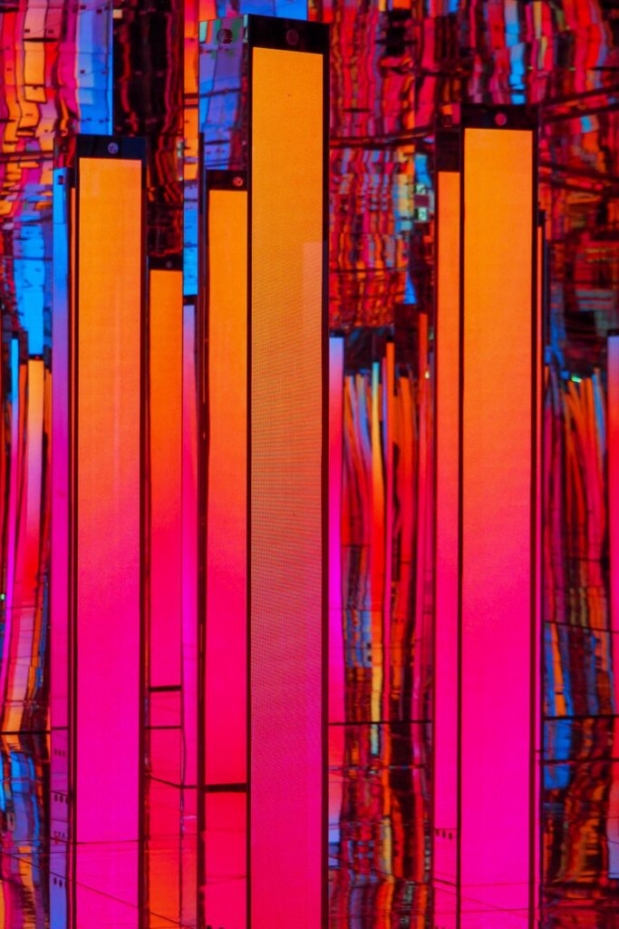 Red and pink interactive digital panels inside AYA Universe