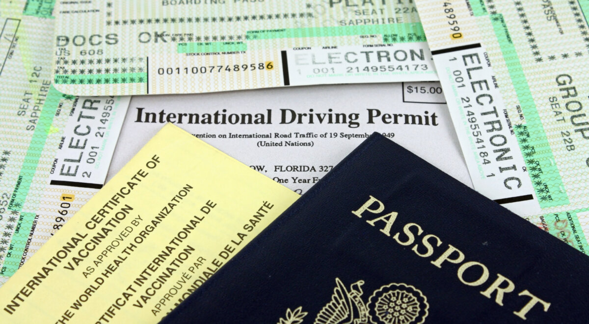 Collection of Travel Documents - Passport, International Driving Permit, International Vaccination Certificate and Airline Boarding Passes