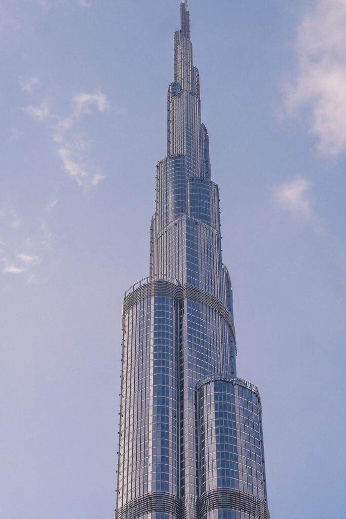 Burj Khalifa viewed from street level against a clear blue sky
