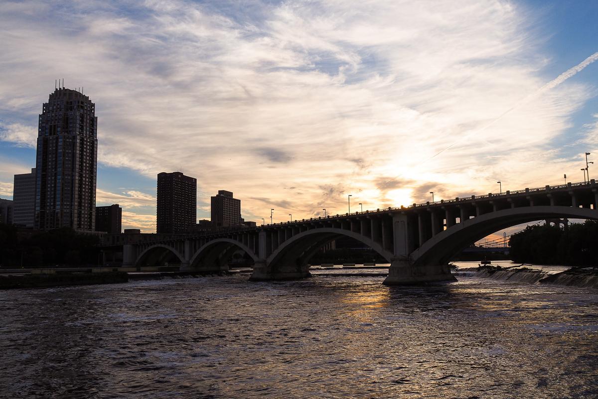 Golden sunset over Mississippi River and Minneapolis skyline at Water Power Park