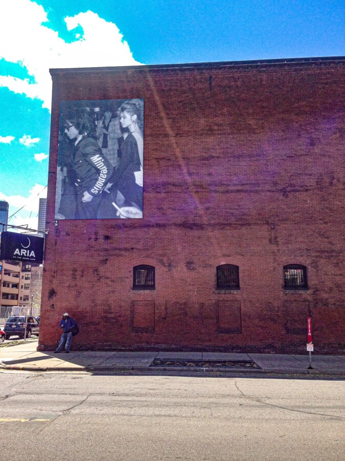 Prince mural in North Loop, Minneapolis - Urban art tribute to musical legend on brick wall under blue sky