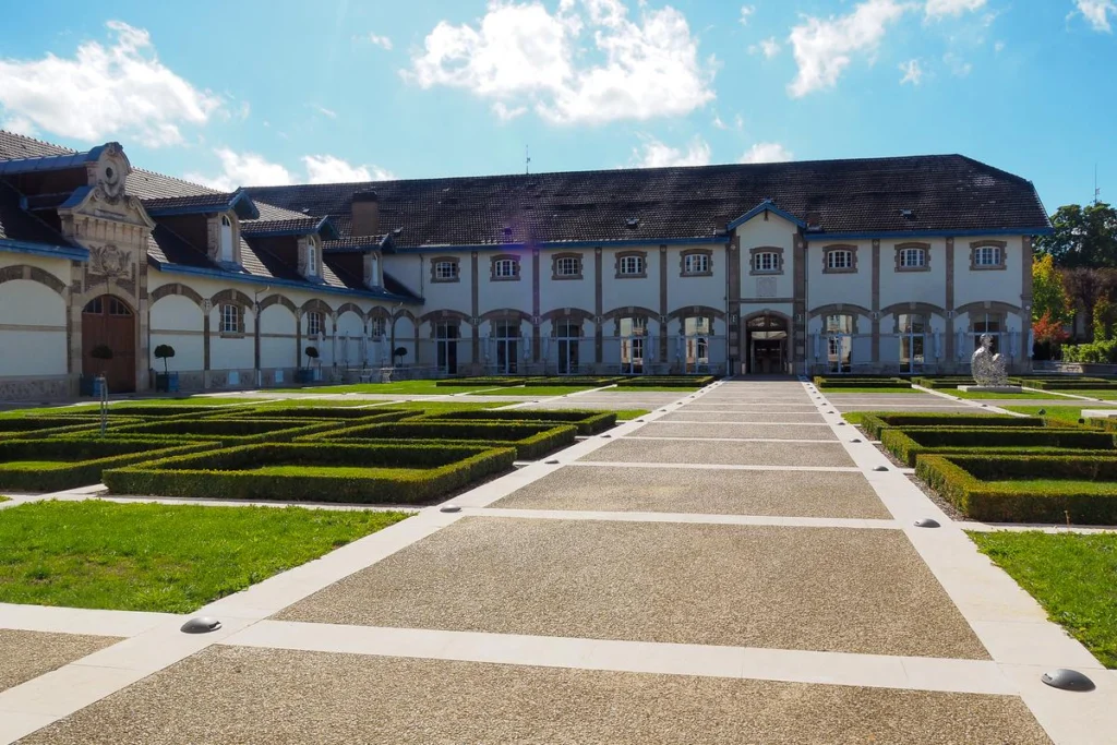 Ruinart Champagne House, Reims, France - historic vineyard, French architecture, luxury winemaking.