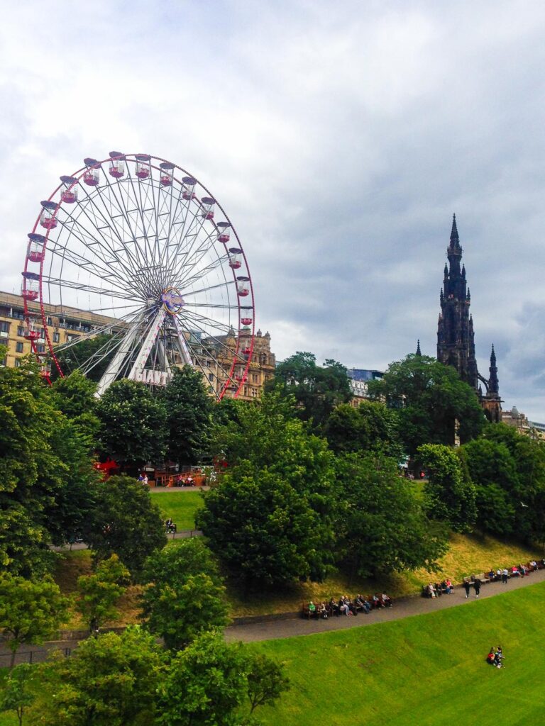 Ferris wheel and Scott Monument in downtown Edinburgh