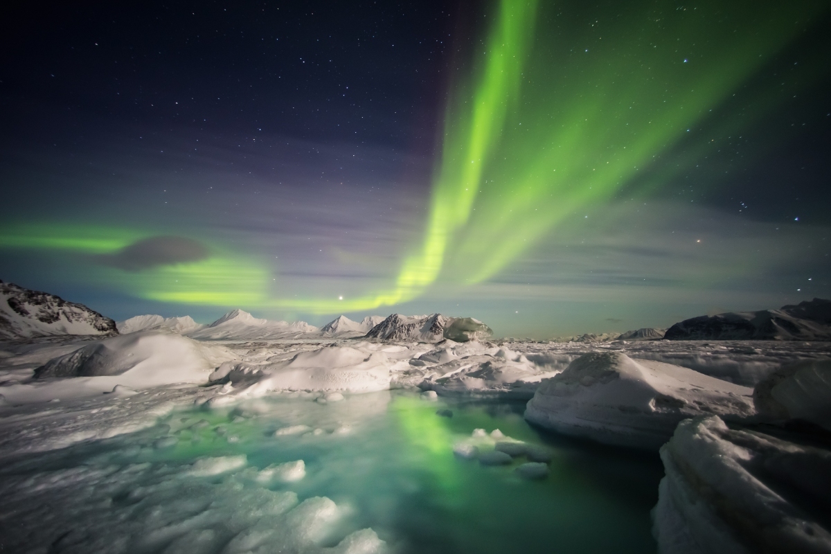 Panoramic view of the northern lights and the winter landscapes at Spitsbergen, Svalbard, Norway