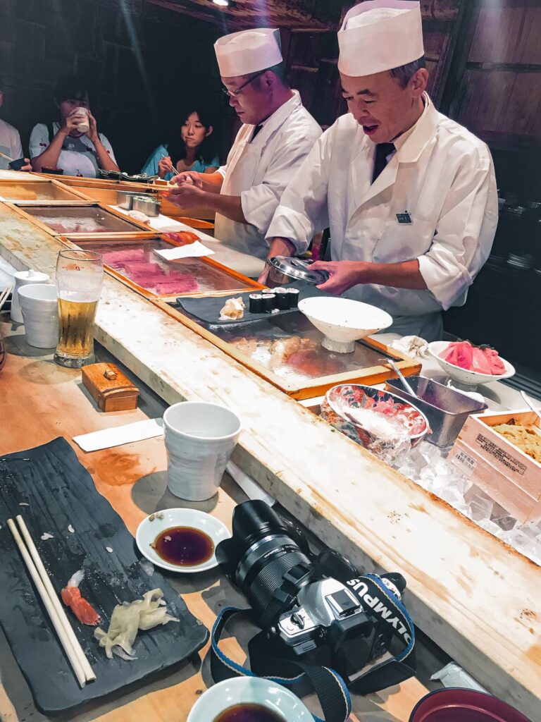 Master sushi chefs preparing fresh sushi at Tsukiji Market Tokyo