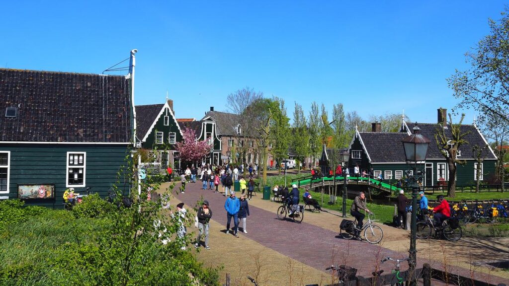 Bustling day at Zaanse Schans, historic Dutch village with traditional houses, windmills, and cultural exploration.